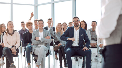 business coach at a meeting with a group of young business people