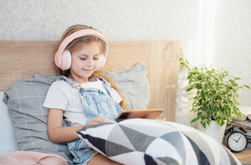 Poster - Cute Little girl  using tablet at home