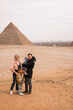 happy tourist family in Giza. holiday travel tpur near Pyramid of Khafre, Egypt