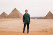 man against the background of the Egyptian pyramids
