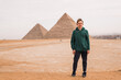 man in front of the Egyptian pyramids