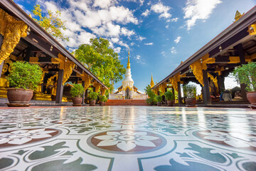 Wall Mural - Beautiful white chedi with golden top behind two open-sided pavilions at Wat Phra That Doi Phra Chan. The Thai Buddhist temple on the top hill of Doi Phra Chan mountain in Mae Tha, Lampang, Thailand.