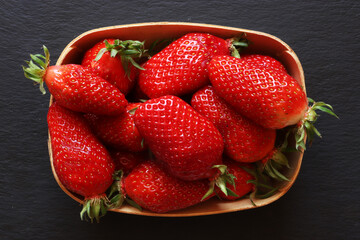 Wall Mural - Photography of a tray of strawberries on slate for food illustrations