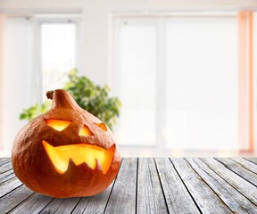 Wall Mural - Festive background with smiley beautiful carved orange Jack-O-lantern pumpkin