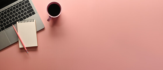 Poster - A top view of office utilities flat lays such as note books, laptop and a cup of coffee on an empty pink space on a background, for business and technology concept.