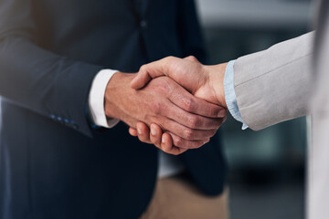 Poster - It all boils down to trust. Cropped shot of two businessmen shaking hands in a modern office.