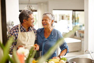 Poster - Putting a lot of love into their meal. Shot of a happy senior couple cooking a healthy meal together at home.