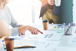 © Arnéll K/peopleimages.com - Lets focus on our customers. Cropped shot of unrecognizable businesspeople working together in an office.