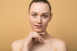 © Павел Костенко - Portrait of attractive and happy naked caucasian girl isolated on beige studio background.