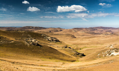 Wall Mural - Travel to Lesotho. Landscape of mountains and grassy hills in Sehlabathebe National Park