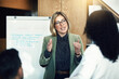 © Daniel L/peopleimages.com - Heading up a winning project. Shot of a group of colleagues having a brainstorming session in a modern office.