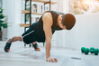 © Timeimage - Young Asian man exercise at home