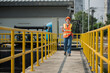 © VIEWFOTO STUDIO - Engineer woman  onsite check waste water treatment plant. Young woman  service engineer  on waste water treatment plant.