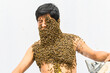 © Peruphotoart - Beekeeper covered by bees, he has the queen bee on his neck so all the bees stick to his body. surrealism.