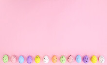 Pastel Easter Eggs On Bright Pink Background Neatly Ordered On The Bottom. Spring Holidays Copy Space Concept.