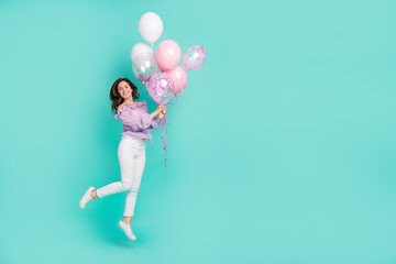 Wall Mural - Full size portrait of cheerful pretty lady hold air balloon enjoy occasion event isolated on turquoise color background