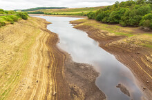 Leighton Reservoir In Nidderdale, North Yorkshire, UK, With Very Low Water Levels Following A Prolonged Heatwave And No Rainfall.  Horizontal.  Copy Space.