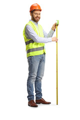 Full length shot of a smiling male engineer using a steel tape measure