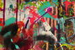 Splatters and drips cover the canvas in this graffiti style abstract painting for backgrounds.