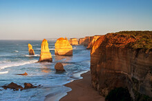 Sunrise Over Twelves Apostles In Great Ocean Road, Victoria, Australia. The Twelve Apostles Is A Collection Of Limestone Stacks Off The Shore Of The Port Campbell National Park.