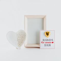 Sticker - A Valentine's day gift set including a frame, card, and a heart in white color