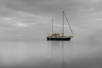 Sticker - Abandoned boat in the medway river under the cloudy skies