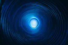 Blur Glow Background. Galaxy Portal. Moonlight Radiance. Defocused Neon Blue Color Lunar Light Sphere In Ridged Swirl Texture Tunnel On Dark Black.