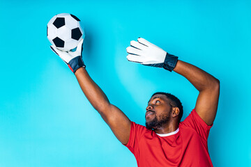 happiness brazilian player man over isolated blue background