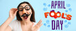 Young woman in funny disguise on blue background. April fools' day celebration