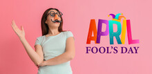 Young Woman In Funny Disguise On Pink Background. April Fools' Day Celebration