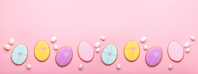 Wall Mural - Tasty Easter cookies with eggs on pink background with space for text