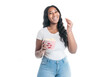 © Louis-Paul Photo - Studio portrait of beautiful brunette young dark-skinned woman eat popcorn