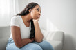 © Louis-Paul Photo - Stressed miserable black woman suffer from grief problem, depressed lonely upset african girl crying alone on sofa