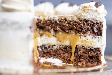 Sticker - A closeup of a delicious cake with chocolate biscuit and cream