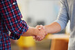 The start of a perfect partnership. Closeup shot of two men shaking hands in a casual office.