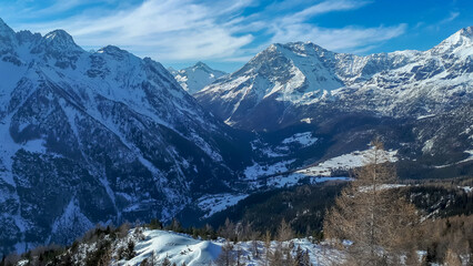 Poster - A scenic view of mountains under the blue sky