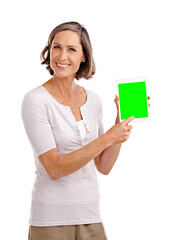 Wall Mural - You should check out this website. Studio portrait of an attractive mature woman holding a digital tablet with a chroma key screen.