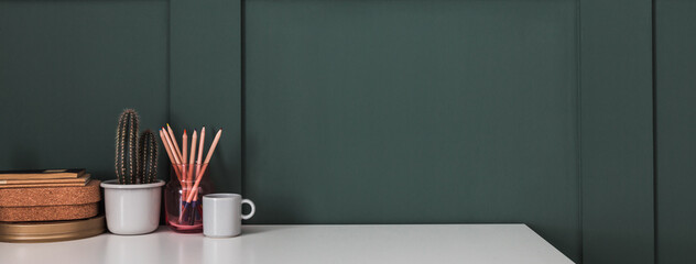 Wall Mural - Home office desk with dark green wall and white table mock up.	