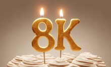 Milestone Cake Celebrating 8000 Followers Or Subscribers. Golden ‘8k’ Number Candles On Cake With Icing In Neutral Tones. 3D Rendering