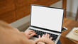 © bongkarn - Close-up image, A female freelancer remote working at cozy coffee shop