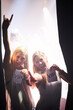 © Alexandra W/peopleimages.com - Backstage beauties. Two young women holding backstage passes at a music concert.