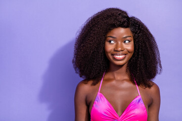 Poster - Photo of dreamy sweet african lady dressed pink sexy clothes smiling looking empty space isolated violet color background