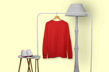 Red long sleeve t-shirt on wooden hanger with display property