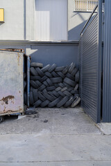 Sticker - A vertical shot of a large heap of tires in a garage