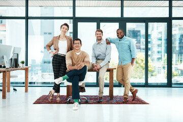 Poster - Were confident in our abilities combined. Portrait of a group of young designers standing together.