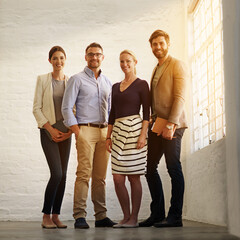 The best in the business. Full length portrait of a business team standing in their office.