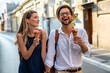 Portrait of happy couple having fun on vacation. People travel happiness concept.