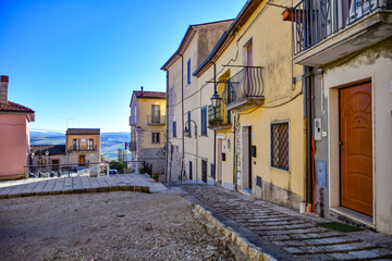 Canvas Print - A street among the characteristic houses of Casalbore, a mountain village in the province of Avellino, Italy.