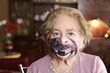Humorous senior woman with missing teeth