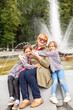 © DariaTrofimova - Portrait of   elderly woman with grandchildren  on   spring day in   park.